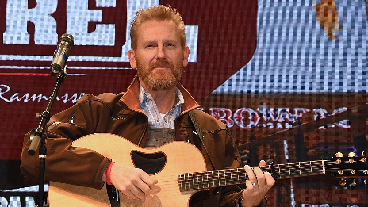 Rory Feek performing on stage