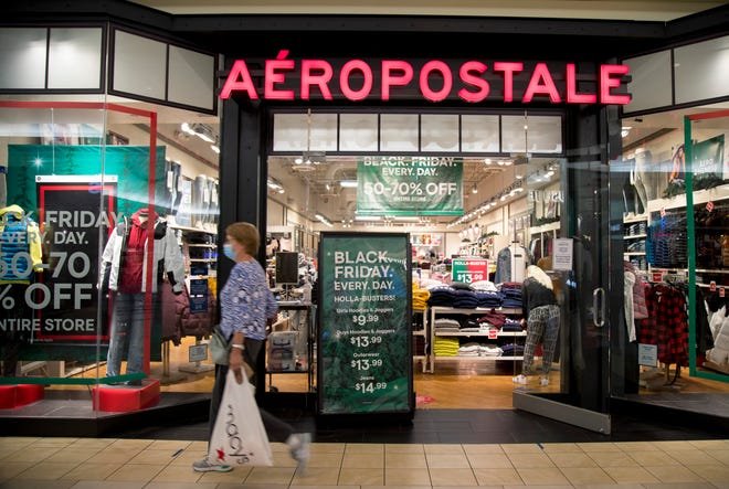 A shopper walks by Aéropostale at the Edison Mall on Thursday, Nov. 12, 2020. Aéropostale is one of the stores in the mall that has started holiday promotions for shoppers.