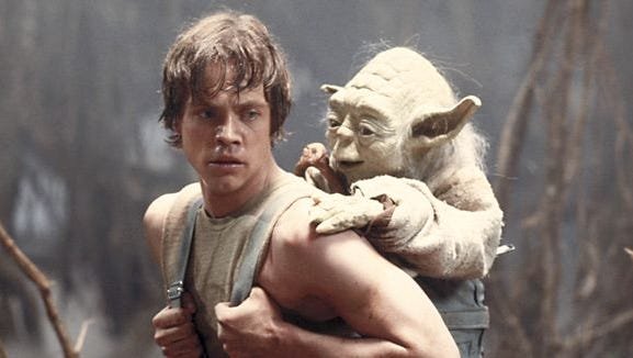 Luke Skywalker carries Yoda on his back during Jedi training in