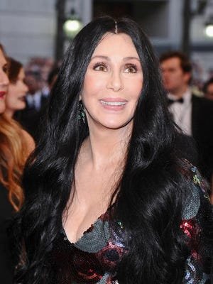 In this May 4, 2015 file photo, Cher arrives at the Metropolitan Museum of Art's Costume Institute benefit gala in New York. Cher has sued a financial management firm she claims defrauded her out of more than $800,000 in investments that went belly-up. The suit was filed Wednesday, June 8, 2016 in Los Angeles County Superior Court on behalf of Veritas Trust, of which the singer is the sole trustee.