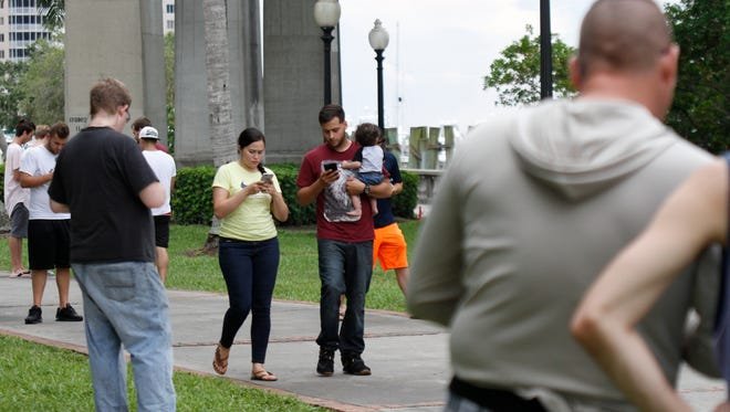 Hundreds joined in the Pokemon Go craze July 14 at Centennial Park in Fort Myers.
