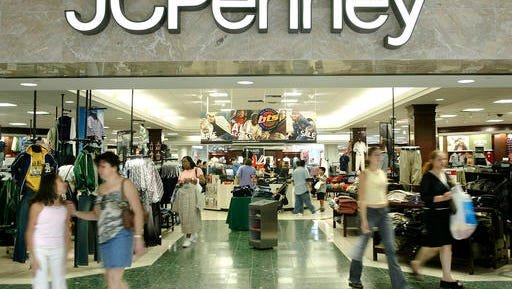 FILE - In this Aug. 16, 2005 file photo, customers walk out of a J.C. Penny department store in Dallas.   J.C. Penney said Friday, Feb. 24, 2017, that it will be closing anywhere from 130 to 140 stores as well as two distribution centers over the next several months as it aims to improve profitability in the era of online shopping.(AP Photo/Matt Slocum)