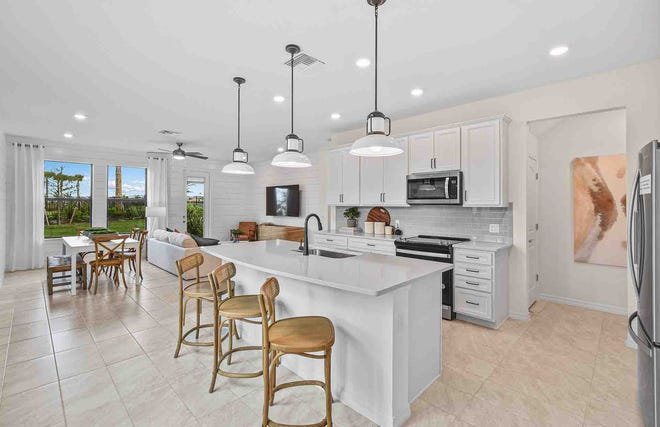 Townhomes at Centex at Sawgrass feature open-concept floor plans with large kitchen layouts and well-appointed features for easy entertaining.