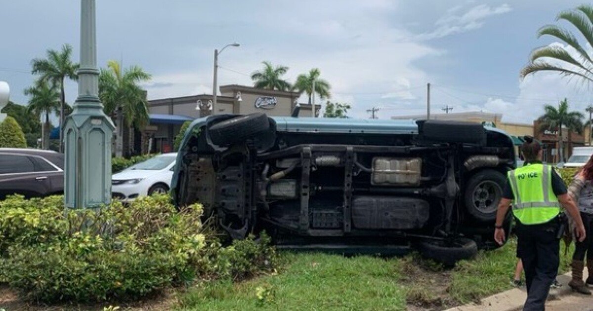 Car turned on its side on Cape Coral Parkway