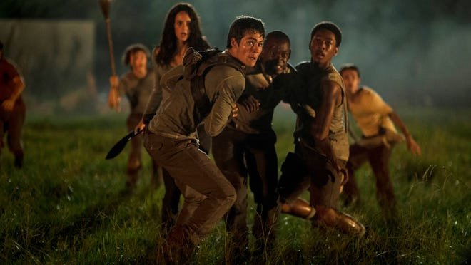 Kaya Scodelario, from foreground left, Dylan O’Brien, Ami Ameen and Jacob Latimore appear in a scene from “The Maze Runner.”
