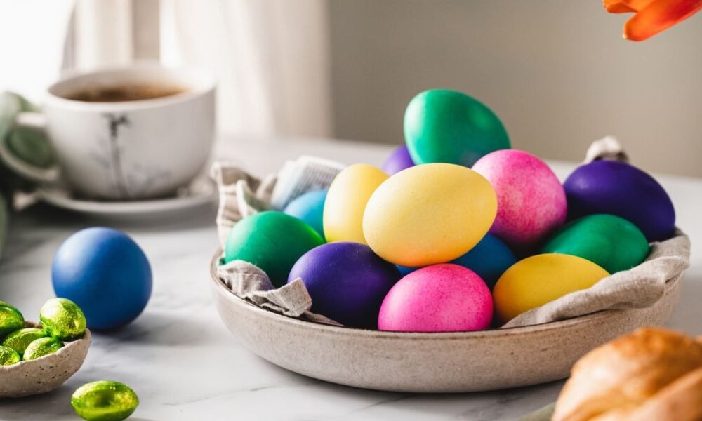 colorful easter eggs with cup of coffee on table royalty free image 1680281746.jpg