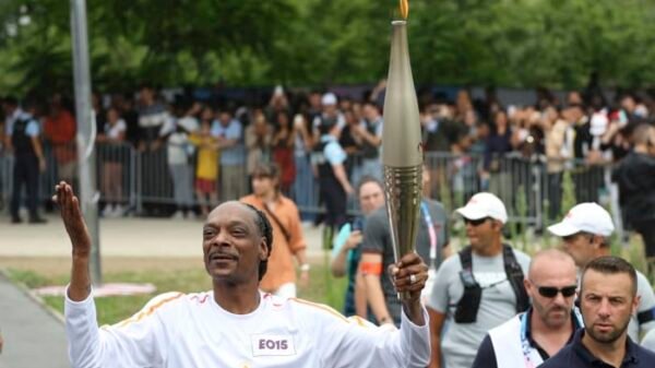 Snoop Dogg Lights Up the Olympic Torch Ahead of Paris Opening Ceremony