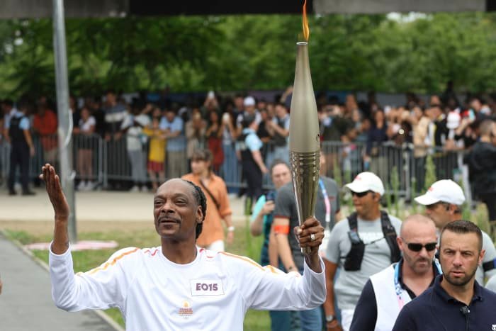 Snoop Dogg Lights Up the Olympic Torch Ahead of Paris Opening Ceremony